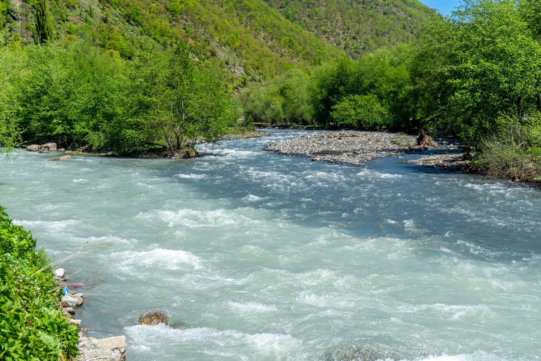 Confluence of the White and Black Aragvi Rivers near Ananuri — striking natural meeting point of two rivers with different shades