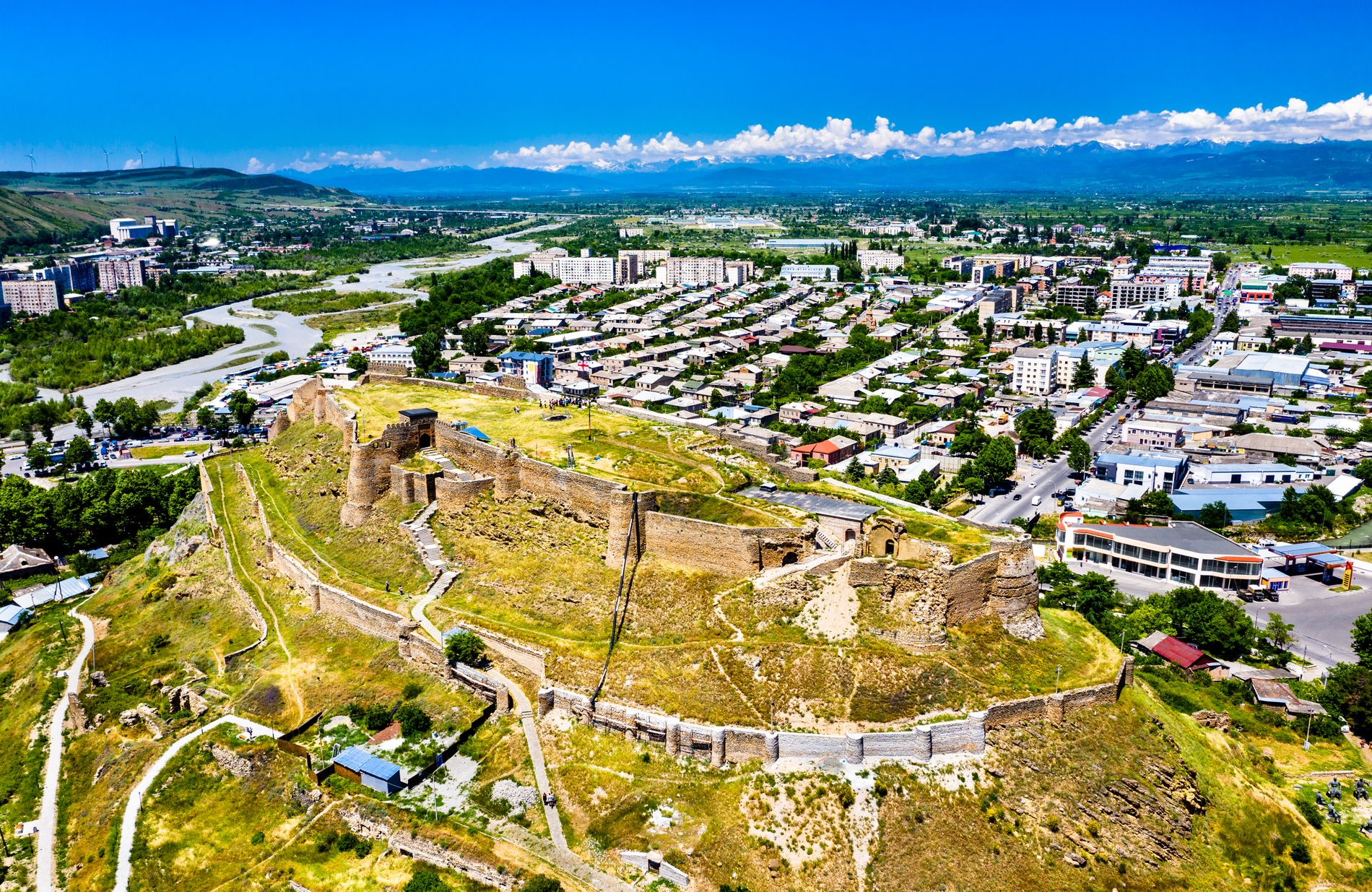 Aerial view of Gori Fortress — medieval stronghold on a hilltop with panoramic views of the city of Gori and surrounding valley