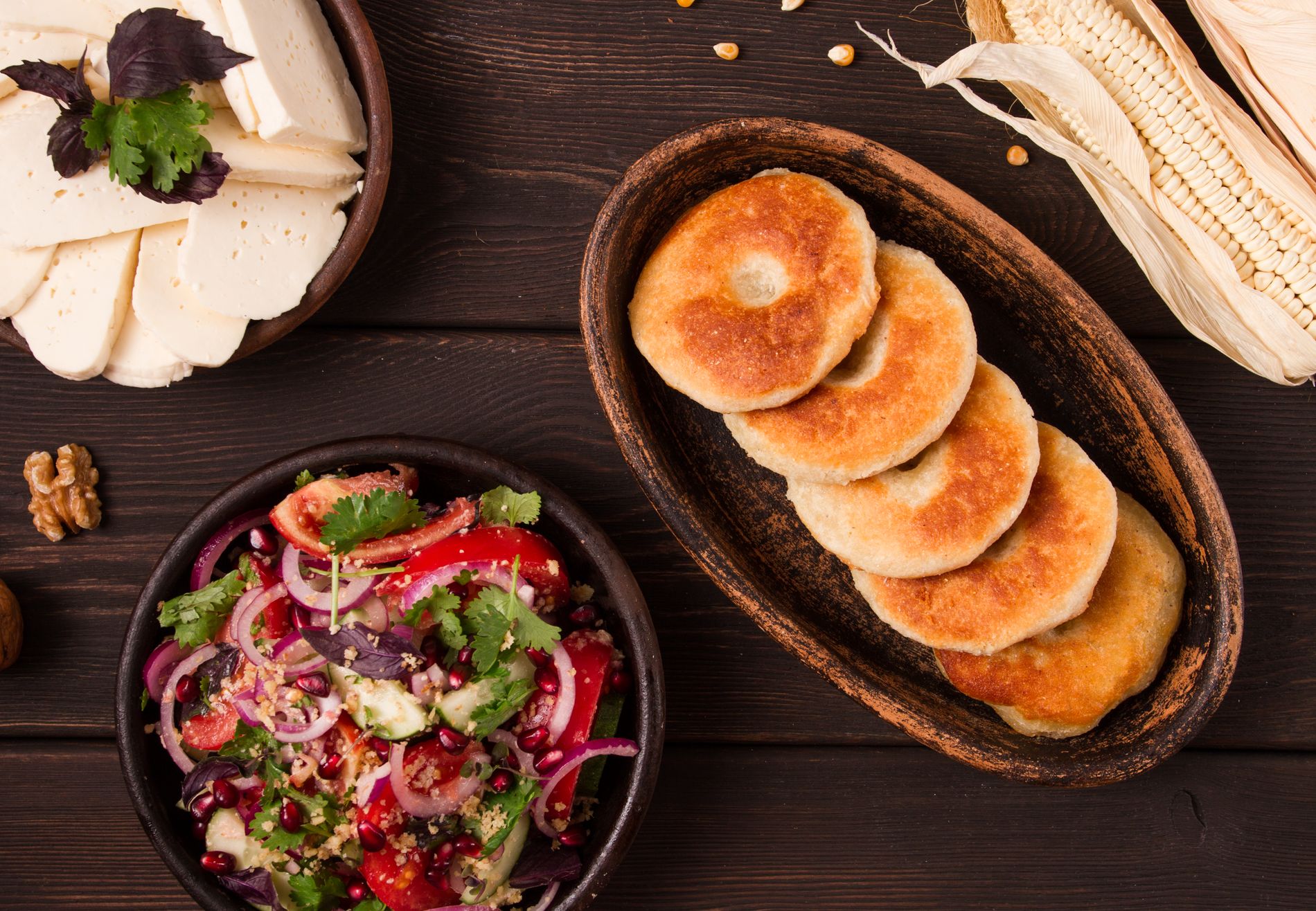 Traditional Georgian dish with mchadi corn bread and soft cheese — a classic local pairing served in Tbilisi restaurants and wine cellars