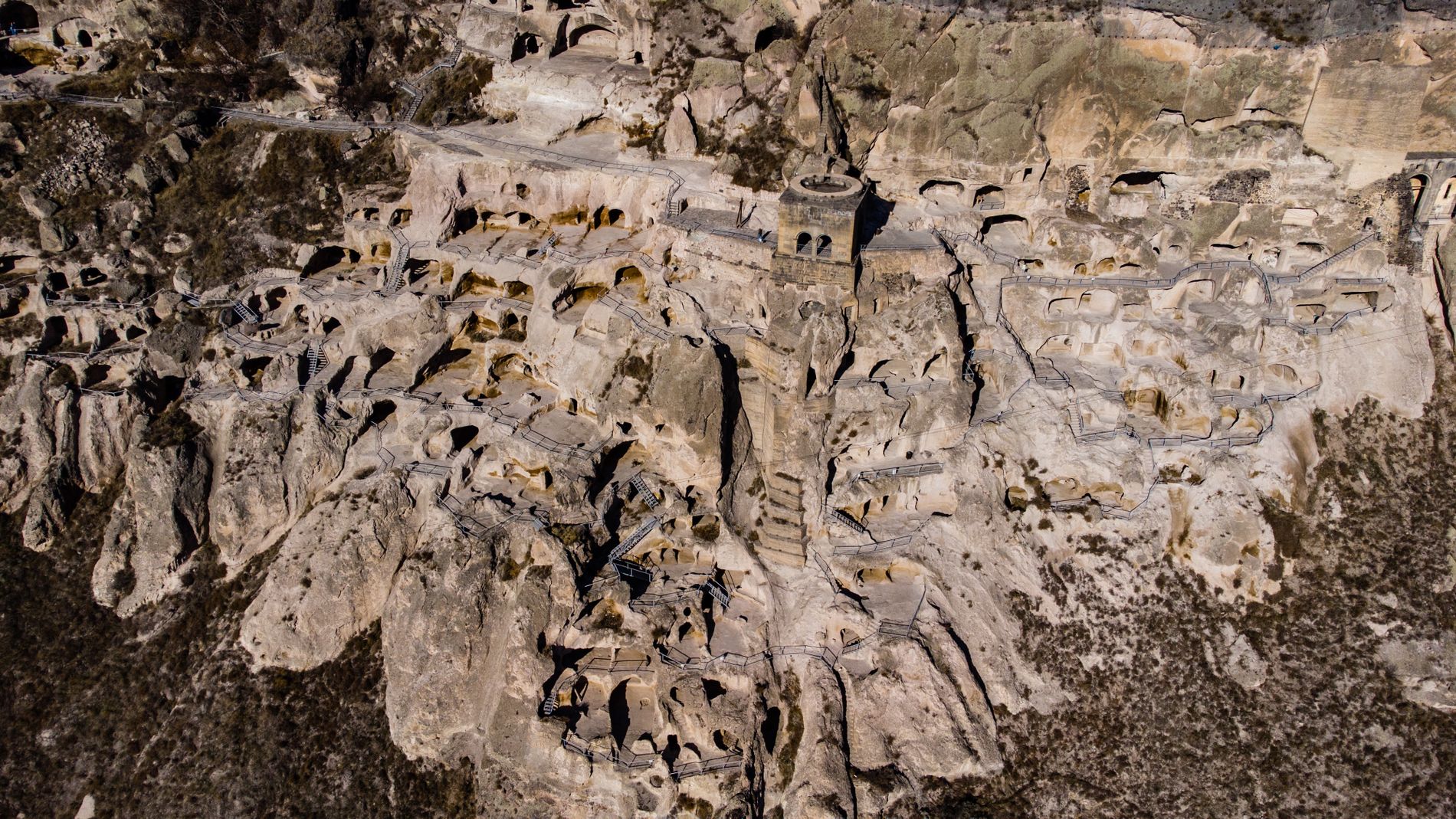 View of Vardzia Cave Monastery in southern Georgia — ancient rock-hewn city carved into cliffs above the Kura River valley