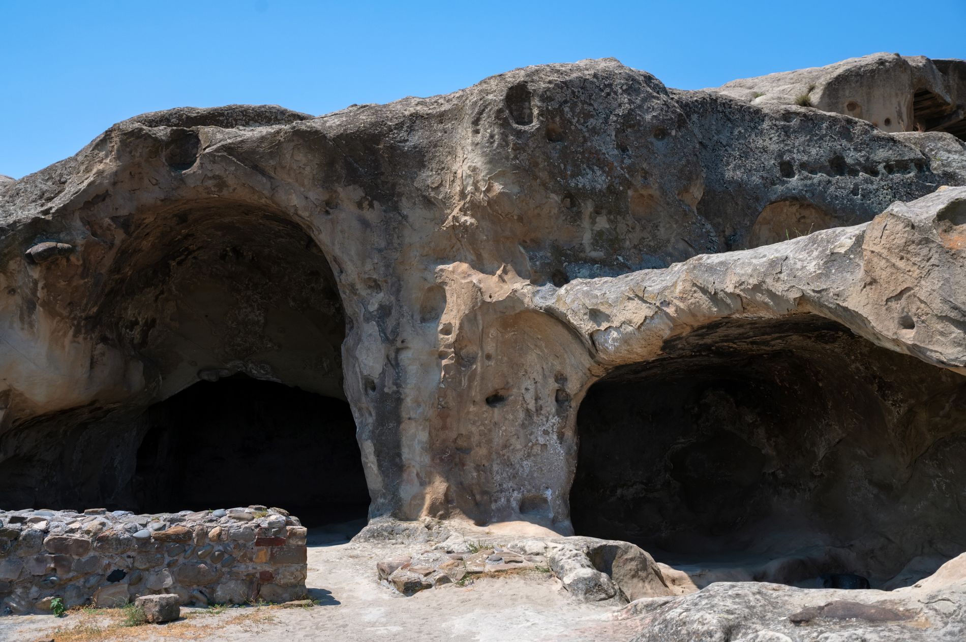 Uplistsikhe — ancient rock-hewn city in central Georgia with tunnels, temples, and open courtyards carved into sandstone cliffs