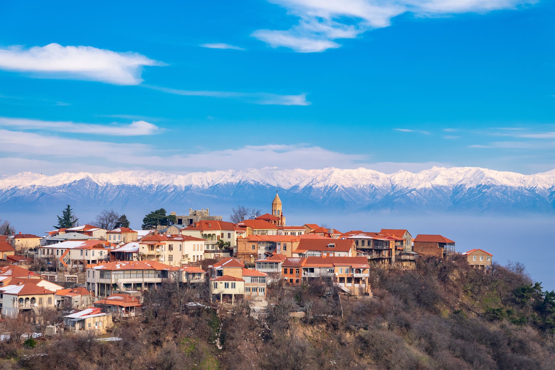 Sighnaghi hilltop town with panoramic views of the Alazani Valley and snow-capped Caucasus Mountains in Kakheti, Georgia