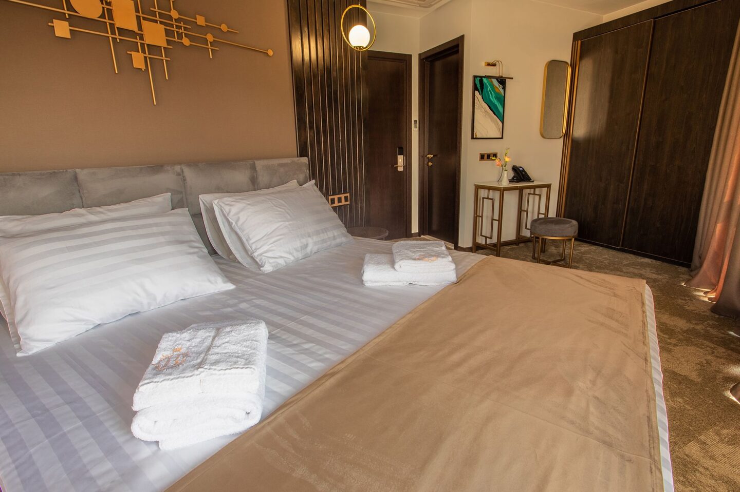 Spacious premier room with high-comfort bed, work desk and wardrobe — boutique hotel stay in Tbilisi with Holy Trinity Cathedral view