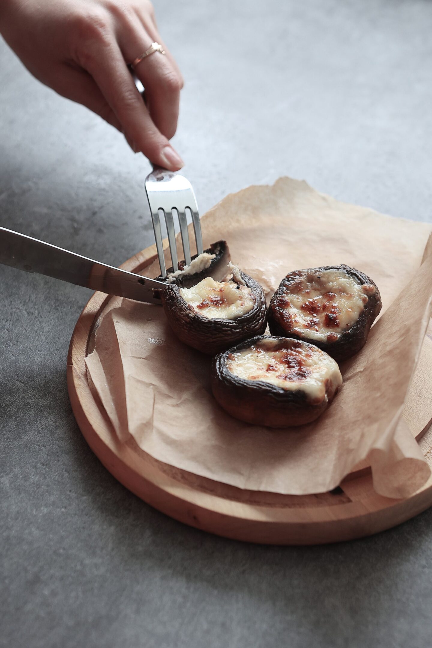 Grilled mushrooms filled with cheese and herbs — hot appetizer served fresh at Bellevue Boutique Hotel restaurant